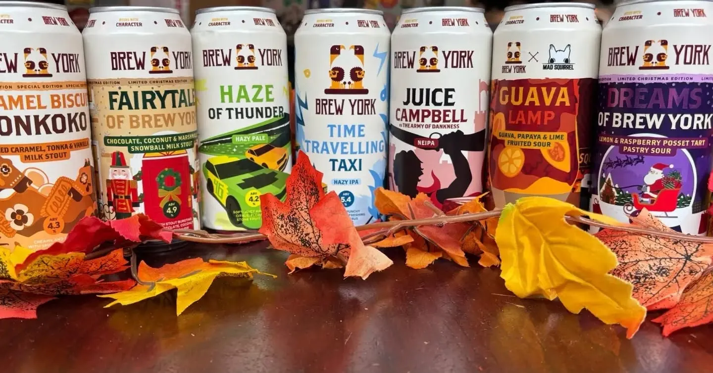 Brew York cans with autumn leaves