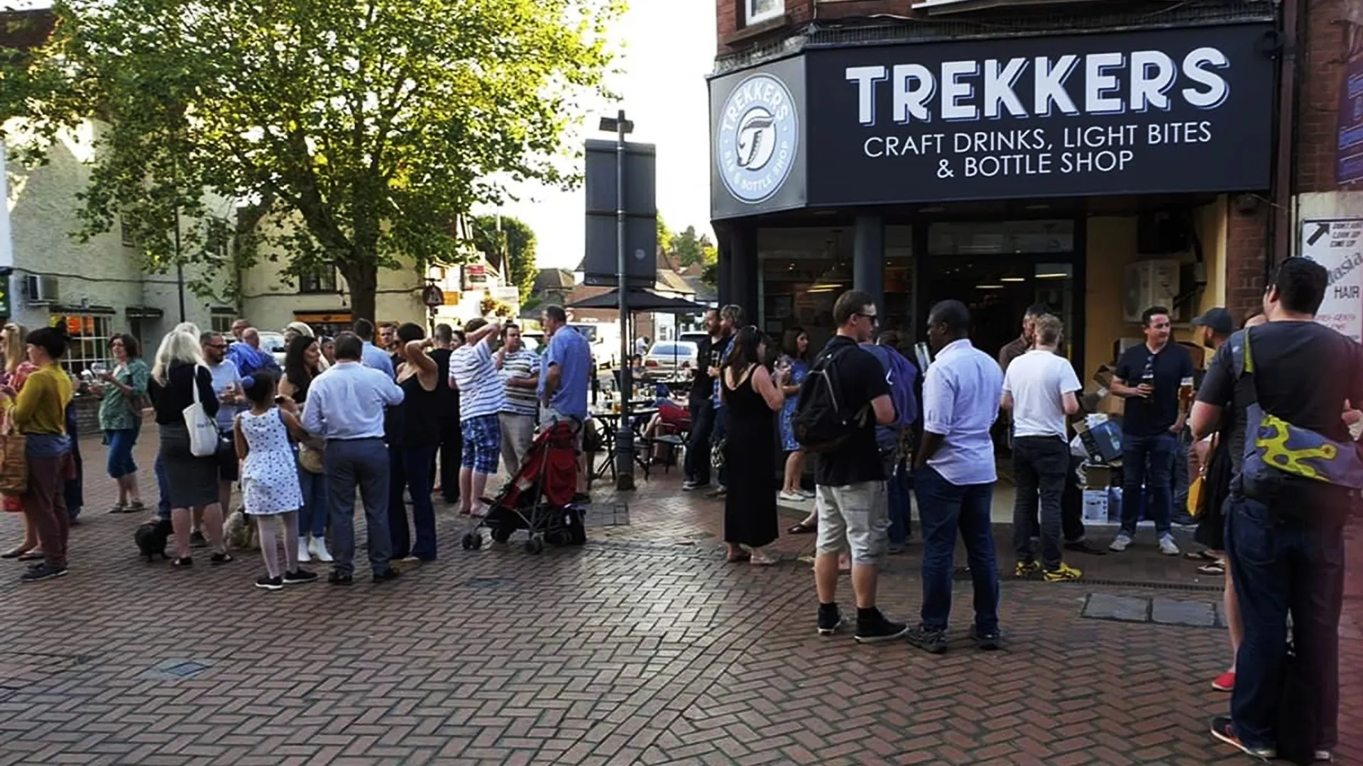 A summer evening crowd outside Trekkers